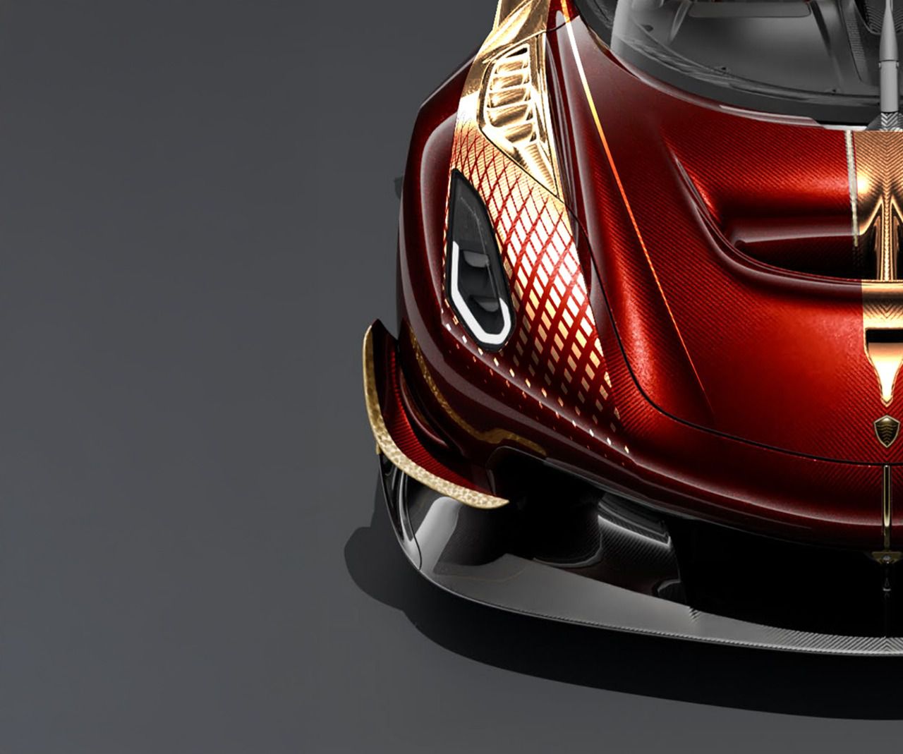 Detalle del frontal del Koenigsegg Sadair Spear Carbon red y detalles en oro